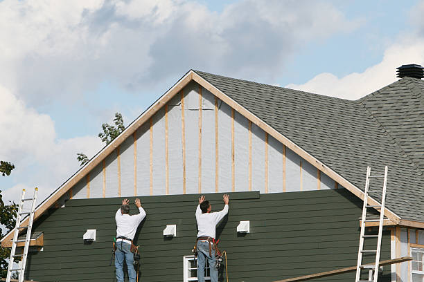 Professional Storm Damage Siding Repair technician working in Baldwin, MD